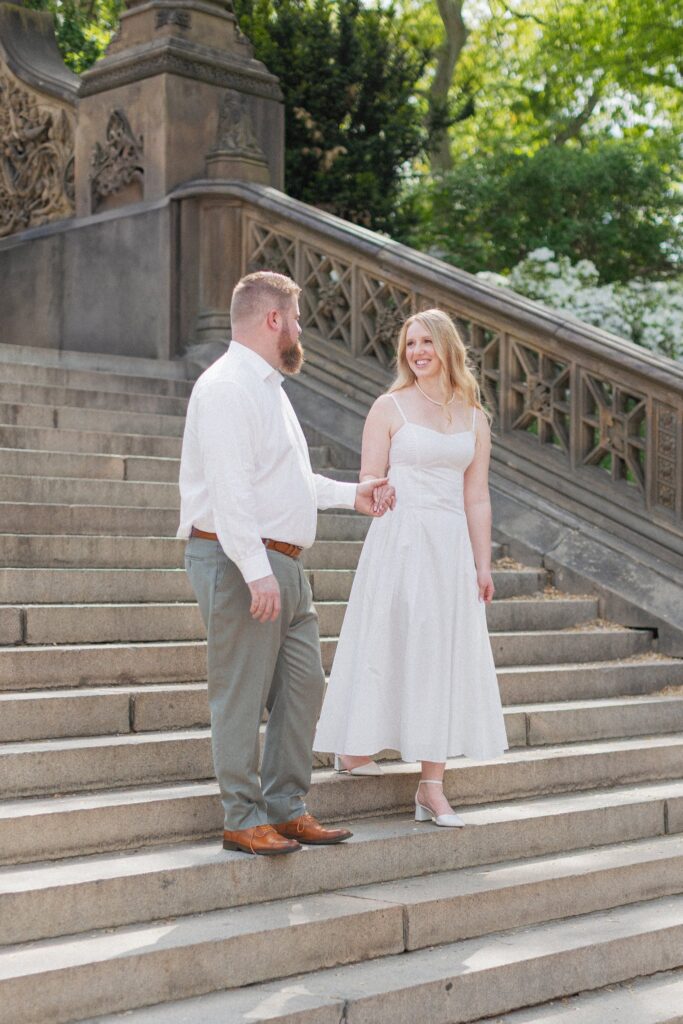 Couple walking down the steps at Bethesda Fountain in NYC