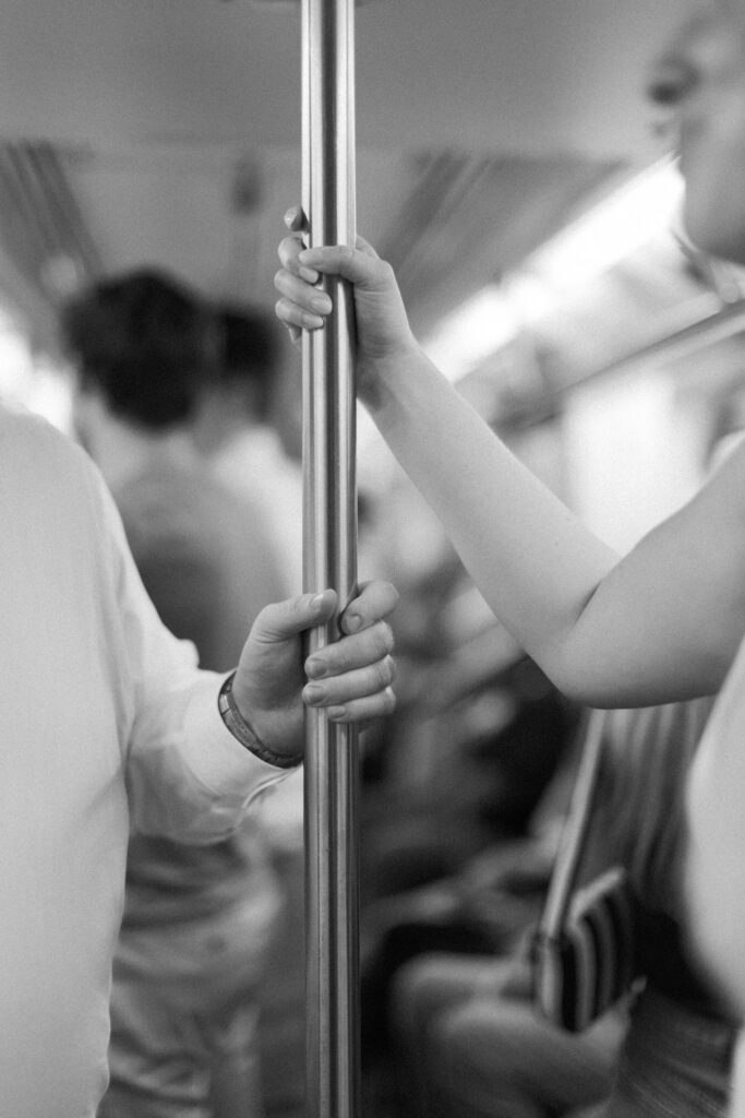 Couple on the subway getting Engagement Photos in NYC