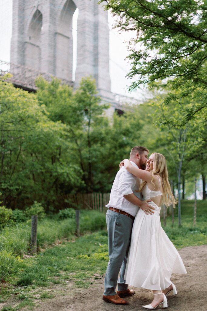 Couple walking in DUMBO Brooklyn during NYC engagement session